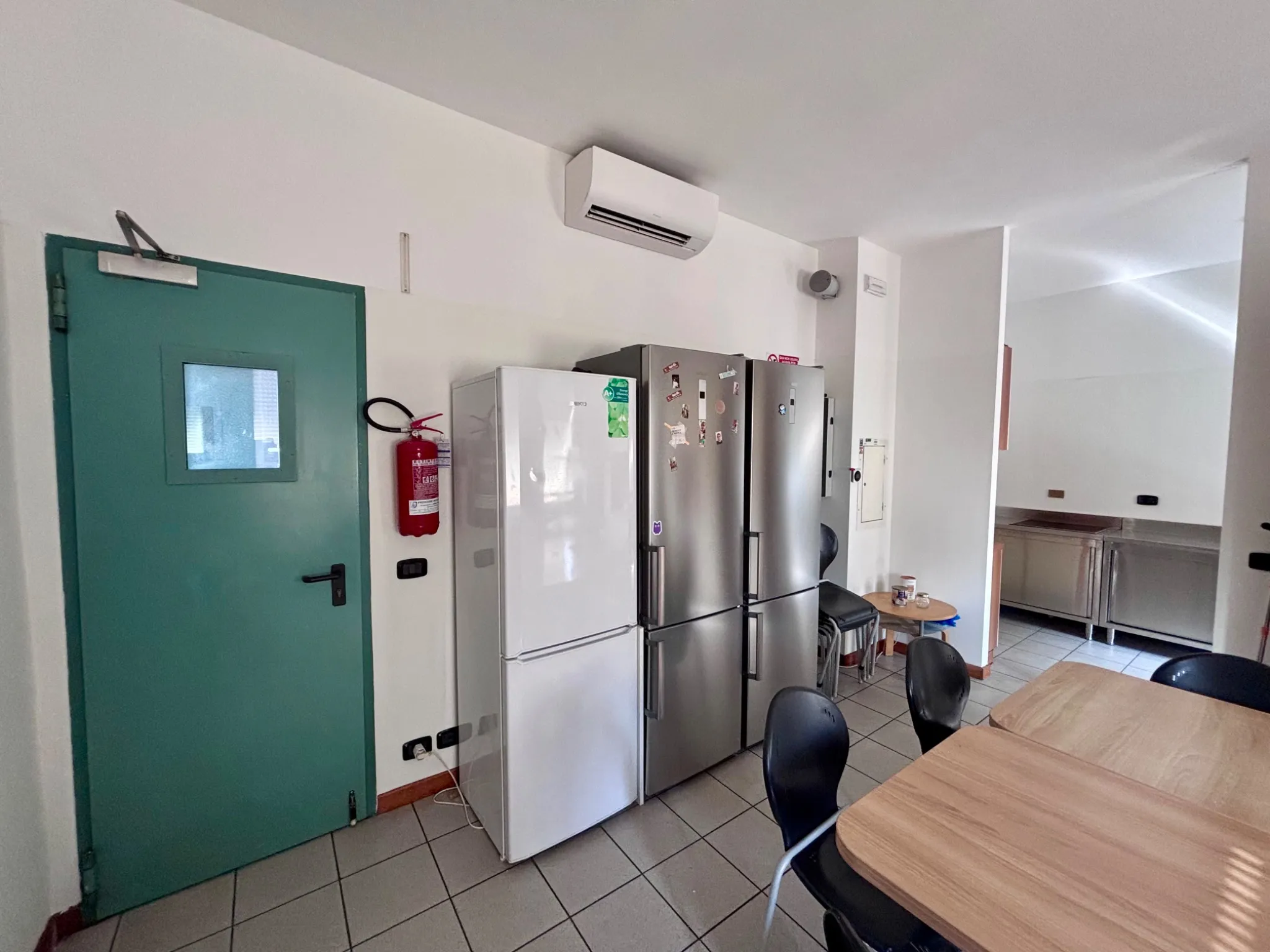 Refrigerators and entrance to the student kitchen at the residence