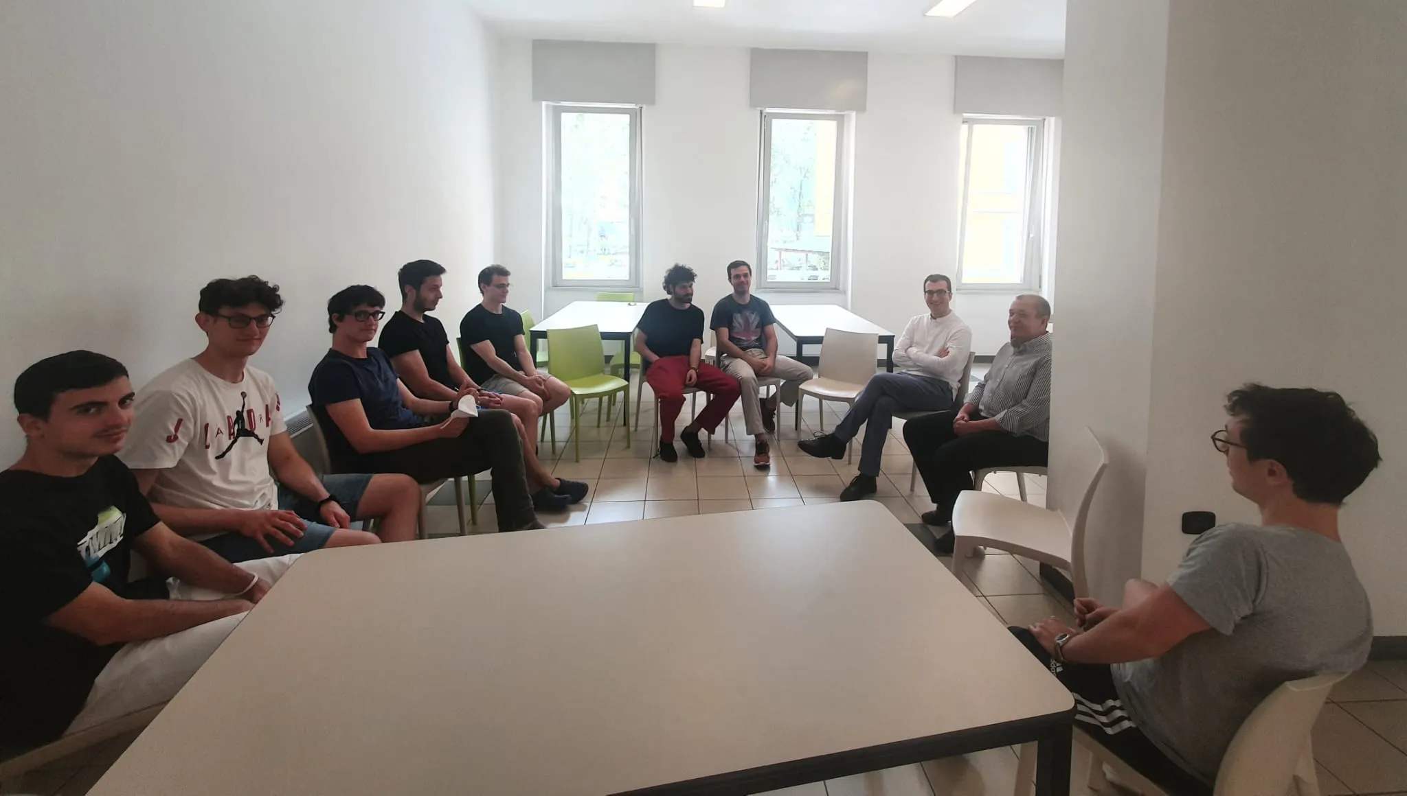 Father Rubens meeting Pensionato Bertoni students in the residence common room